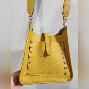 100% leather Rebecca Minkoff Darren Feed Bag featuring silver stud hardware